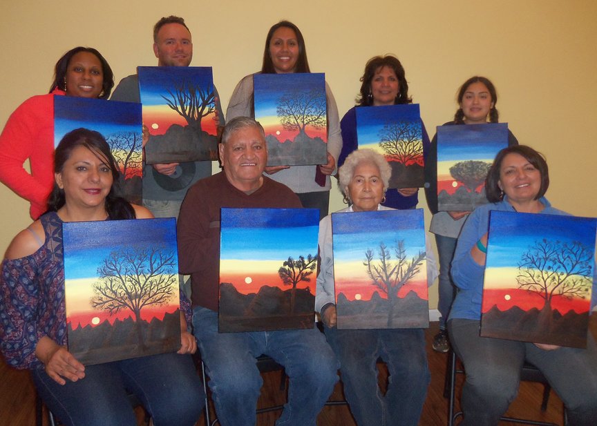 Family painting together in Sedona during birthday weekend celebration.